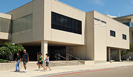 Outside of the Faculty Center, a 2-story white office building on the TAMU-CC campus