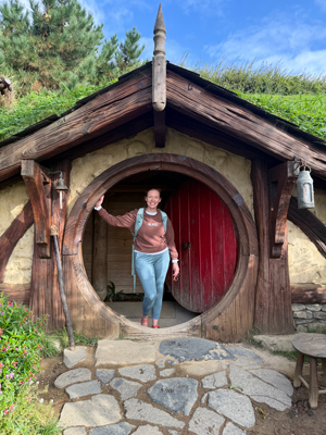 Dr. Pletcher explores a small building with a circular door in new zealand