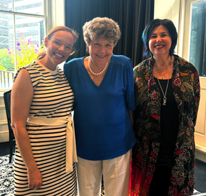 Dr. Pletchers stands with two literacy educators in New Zealand