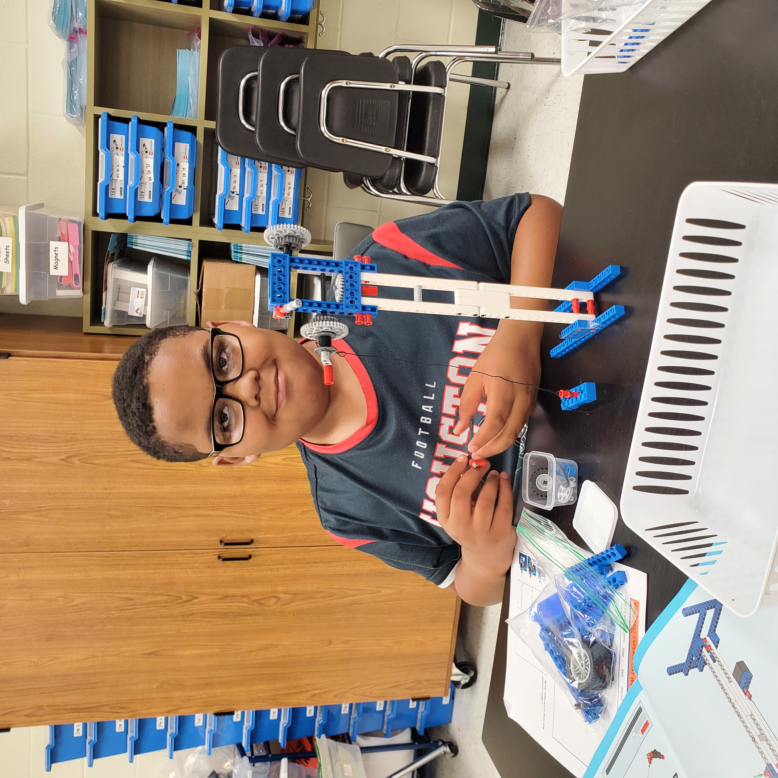 male student with completed project