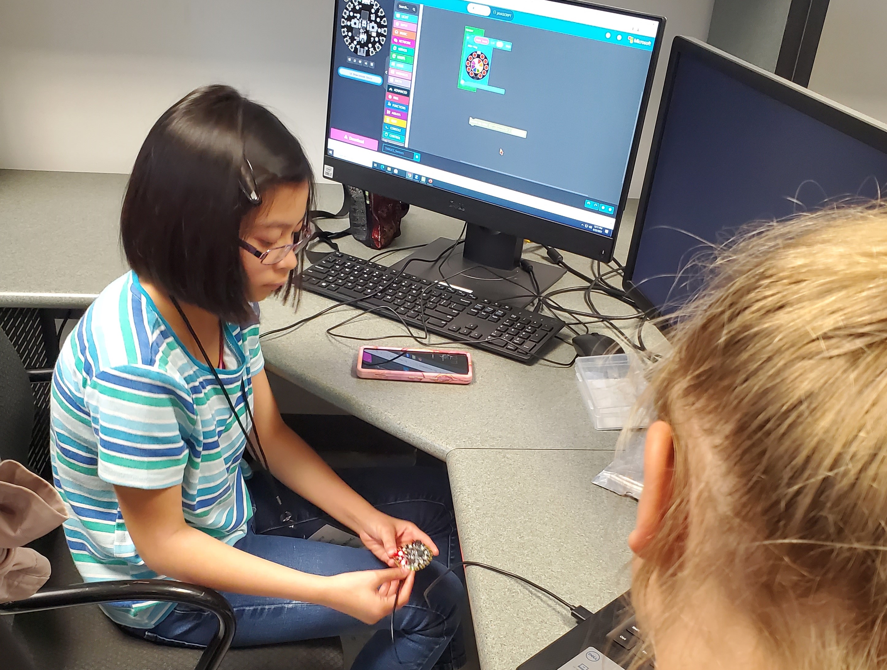 students working on coding adafruit