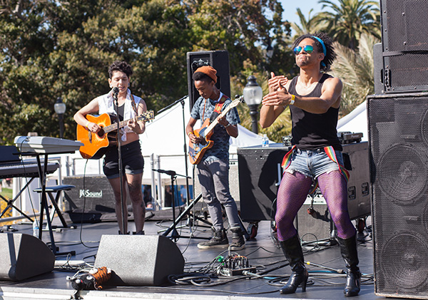 Musicians and ASL interpreters next to each other on stage in San Francisco