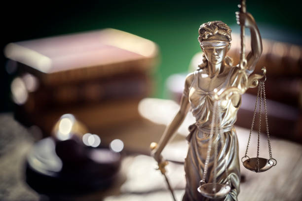 lady justice, books and gavel