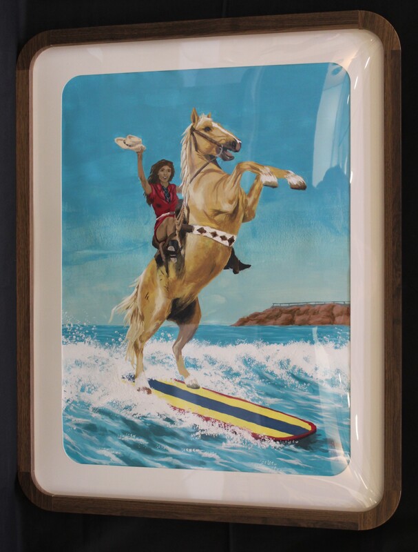 The image is a framed painting depicting a horse rearing on a surfboard with a person in a red shirt holding a cowboy hat.
