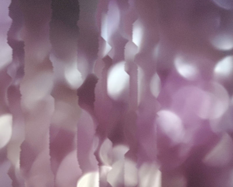 Abstract image with vertical jagged lines and a purple color palette.