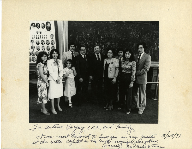 Arturo Vasquez and family with State Senator Carlos Truan at the State Capitol. Vasquez was recognized for his civic service.