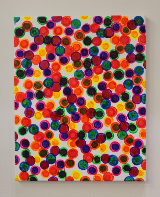 Colorful abstract artwork with overlapping circles in red, orange, yellow, green, blue, and purple on a white background.
