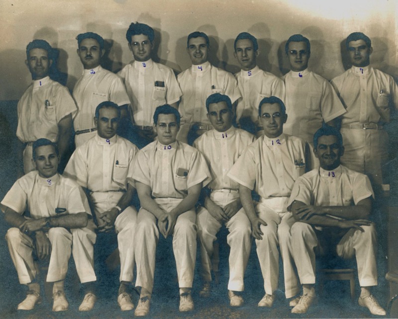 Photograph of St. Joseph's hospital interns with Dr. Garcia seated on the far right. 