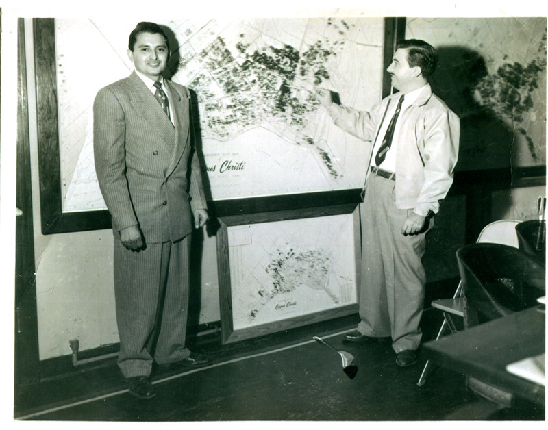 CCISD School Board Trustees, Arturo Vasquez and Arnoldo Lerma, in front of a Corpus Christi Independent School District map.