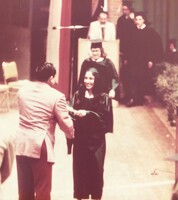 Arturo Vasquez, handing his daughter Nadine, her high school diploma. 