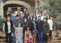 Marie Vasquez and her family attending a family celebration. Colored photograph. 