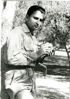 Arturo poses for photo taking a break from playing golf with friends.