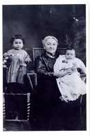 Black and white photograph of baby Altagracia “Yayita" Vasquez, great-grandmother Altagracia Saenz Garcia, and baby Rodolfo Vasquez, Jr. "Fito".