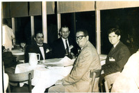 Arturo Vasquez and CCISD School Board Trustees. Vasquez sits next to Superintendent Dana Williams, facing the camera. Franklin Bass and Dr. Cornell Barnard turn to look at the camera