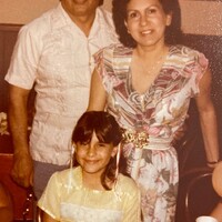 Arturo and Marie Vasquez, with their youngest child, Vanessa, at her 10-year-old Chucky Cheese birthday party.