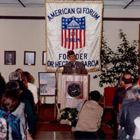 Photograph of Dr. Garcia speaking at an event marking his donation to the Texas A&M University-Corpus Christi Bell Library. 