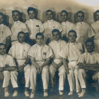 Photograph of St. Joseph's hospital interns with Dr. Garcia seated on the far right. 