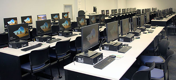 Tables, computers, and chairs in the Second Floor Computer Lab