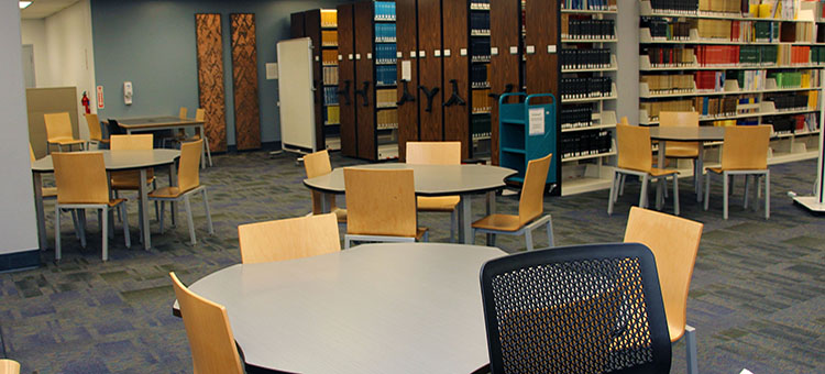 Tables and chairs placed around the 1st Floor of the library