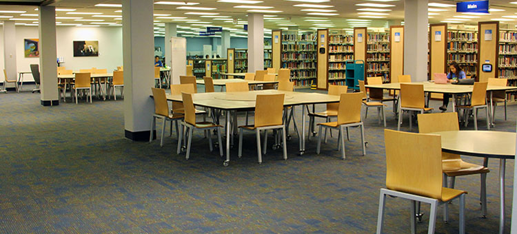 Moveable tables and chairs for group study located on the 2nd floor of the library