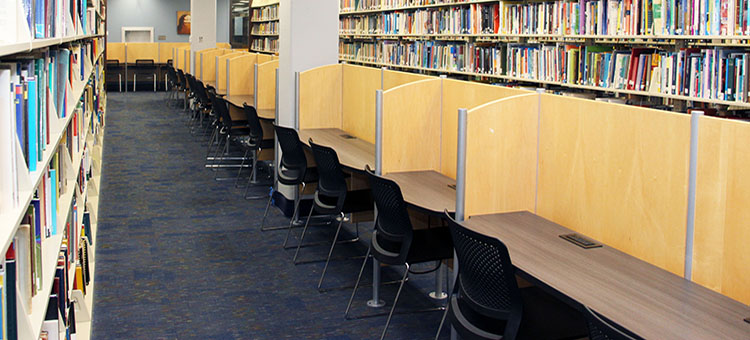 Row of individual and some two-person study carrels located on the 2nd floor of the library
