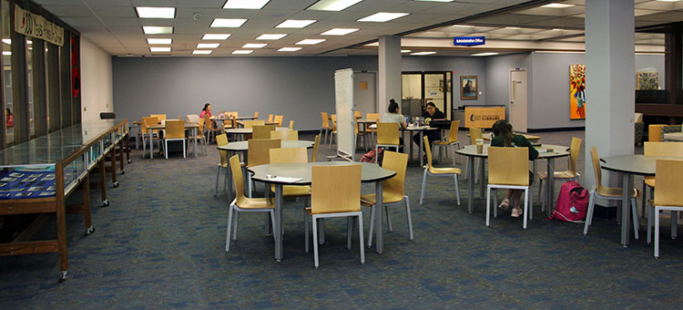 Tables and chairs located outside the Special Collections and Archives department on the 2nd Floor of the library