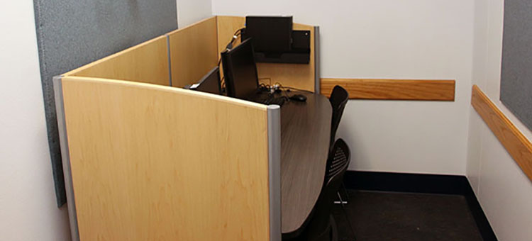 Individual and two-person study room with study carrel, two monitors, one computer, and two chairs