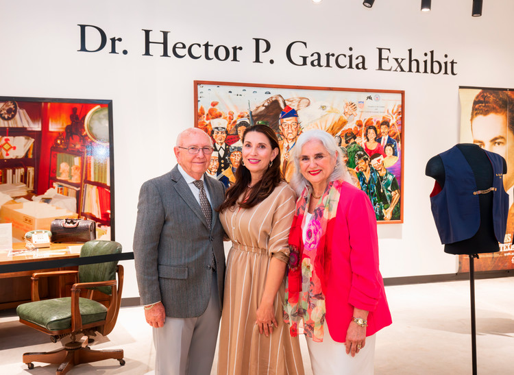 Cecilia+Garcia+Akers+poses+with+guests+in+the+Dr.+Hector+P.+Garcia+Exhibit.