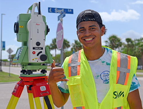 Geomatics student at a computer