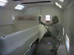 man spray painting caar