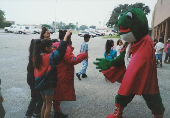 Smog Frog mascot and children