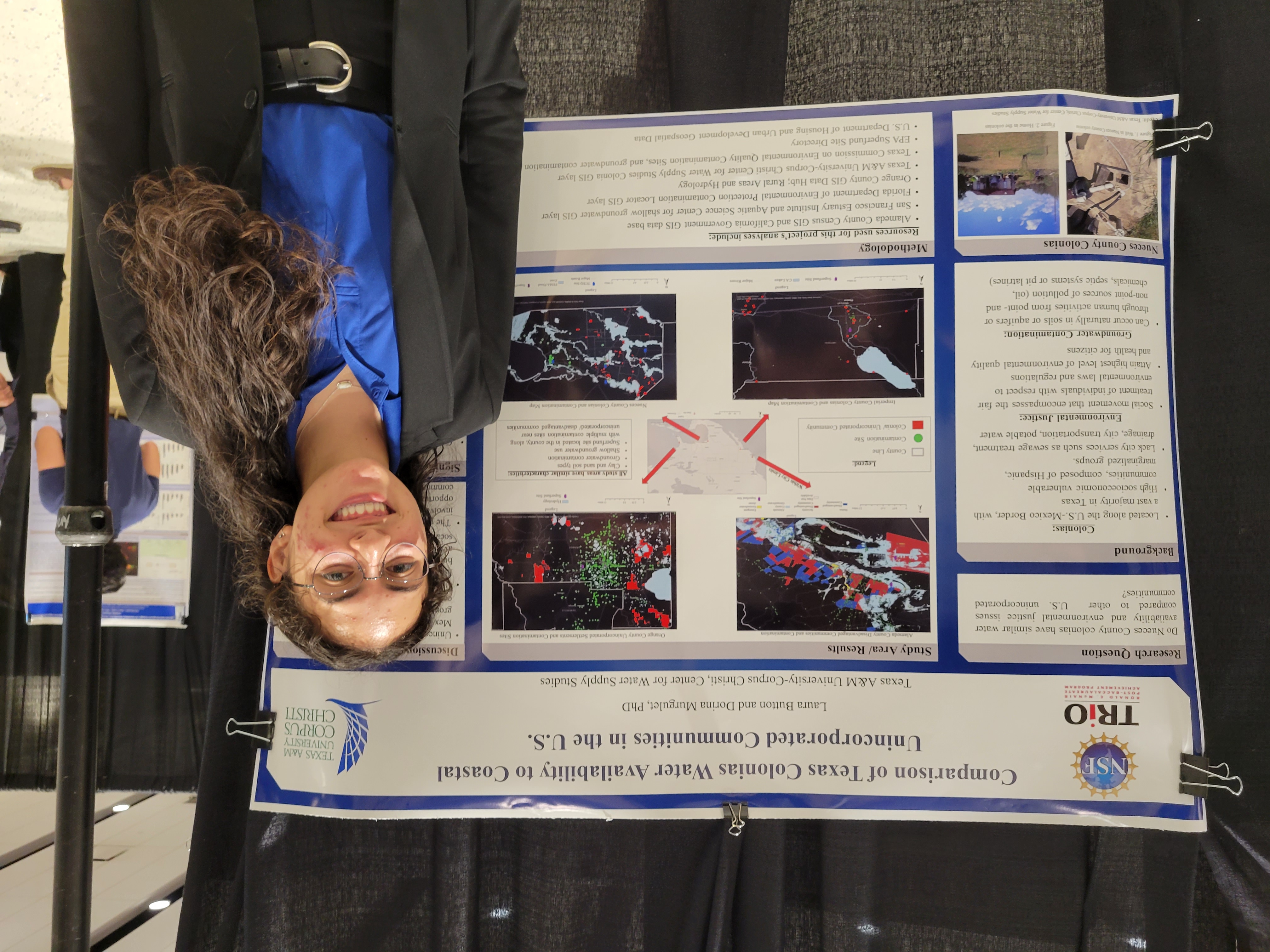 photo of Laura Button next to research poster