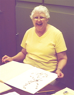 Ruth O'Brien with herbarium mounts