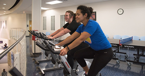 Staff on exercise bikes
